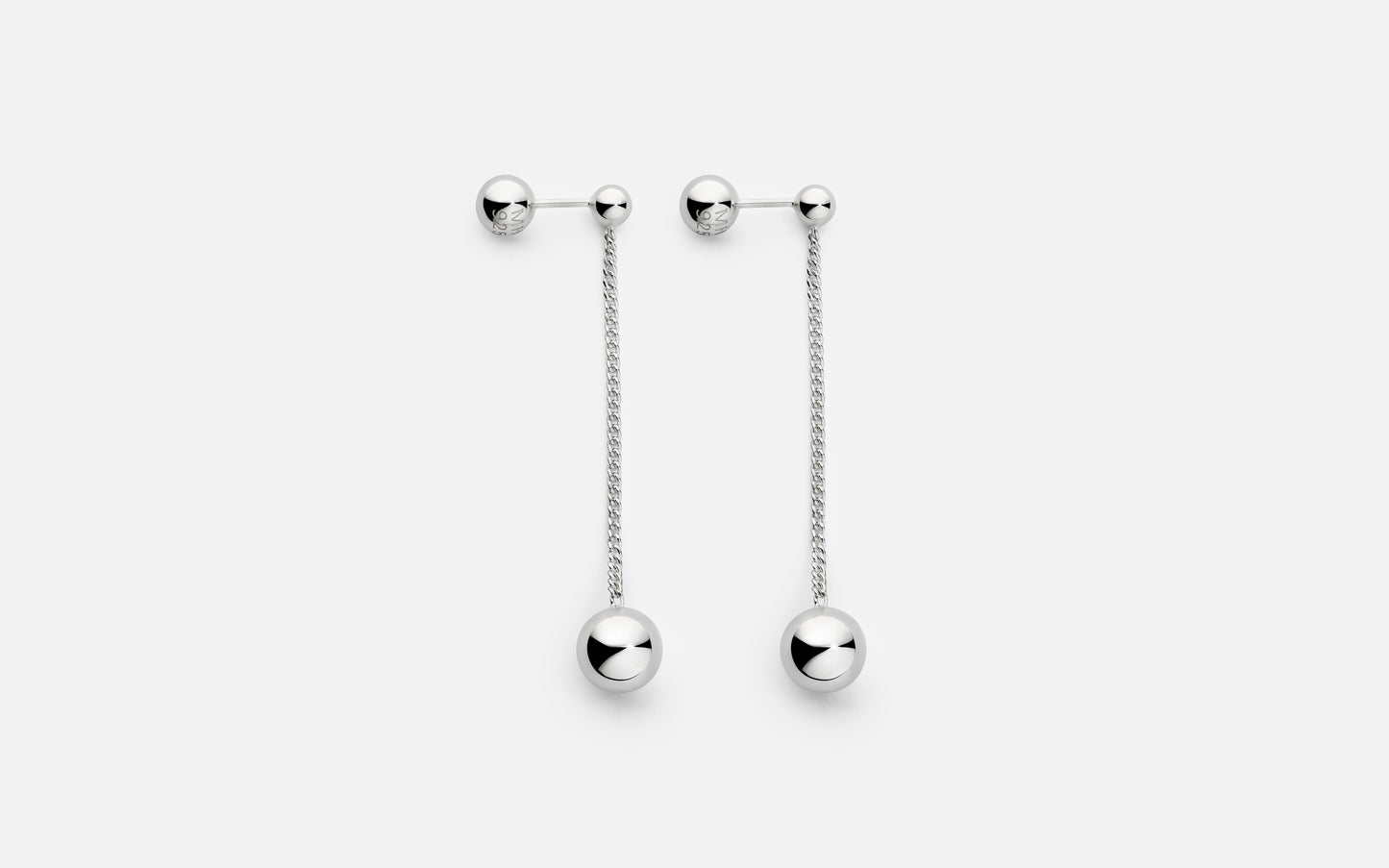 Pair of silver earrings with dangling chains on a white background